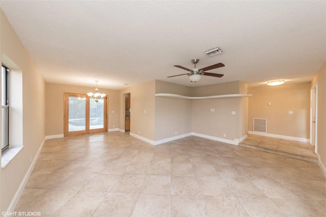 22494 Grouper Court Boca Raton, FL 33428 - Photo 4 of 22 an empty room with a empty space and windows