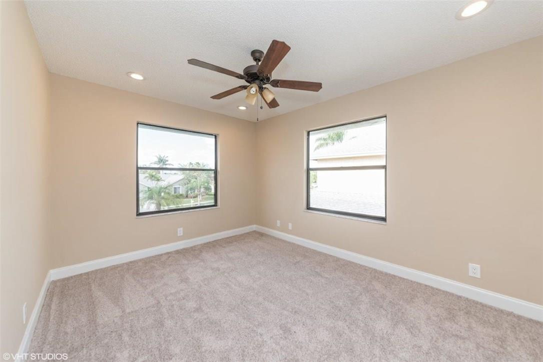 22494 Grouper Court Boca Raton, FL 33428 - Photo 10 of 22 a view of an empty room with a window