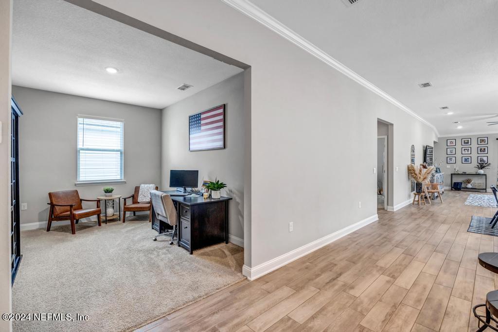 196 Creekmore Drive St. Augustine, FL 32092 - Photo 11 of 51 a living room with furniture and a window