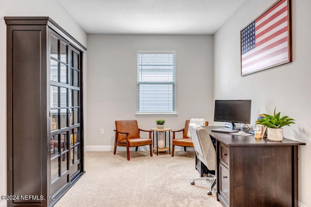 196 Creekmore Drive St. Augustine, FL 32092 - Photo 12 of 51 a workspace with furniture and a window