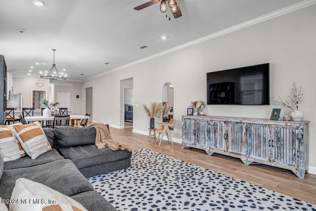 196 Creekmore Drive St. Augustine, FL 32092 - Photo 20 of 51 a living room with furniture and a flat screen tv