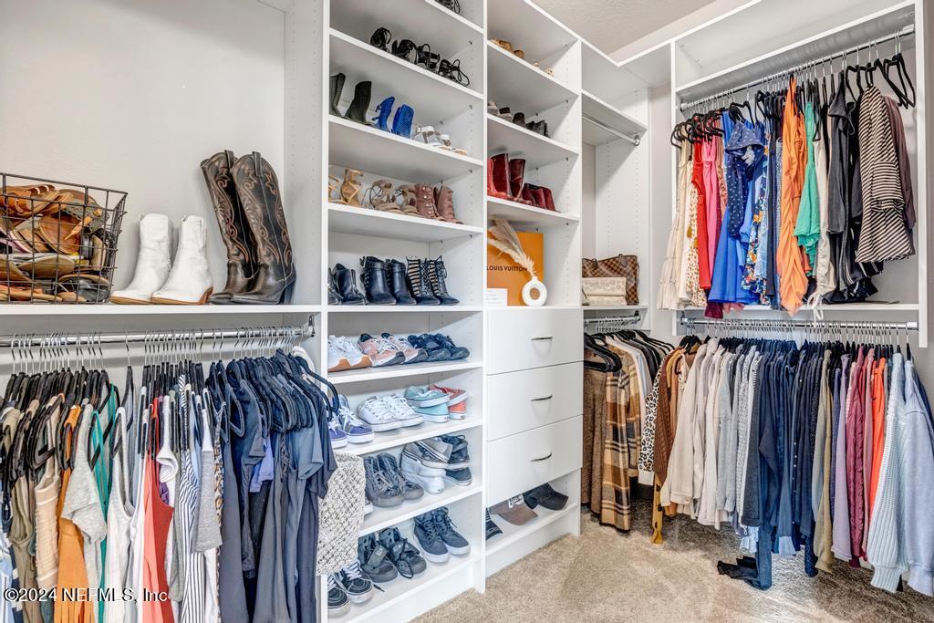 196 Creekmore Drive St. Augustine, FL 32092 - Photo 29 of 51 a view of walk in closet with clothes and shoes