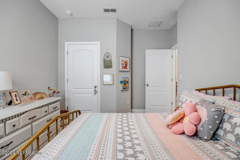 196 Creekmore Drive St. Augustine, FL 32092 - Photo 33 of 51 a bedroom with a bed and closet