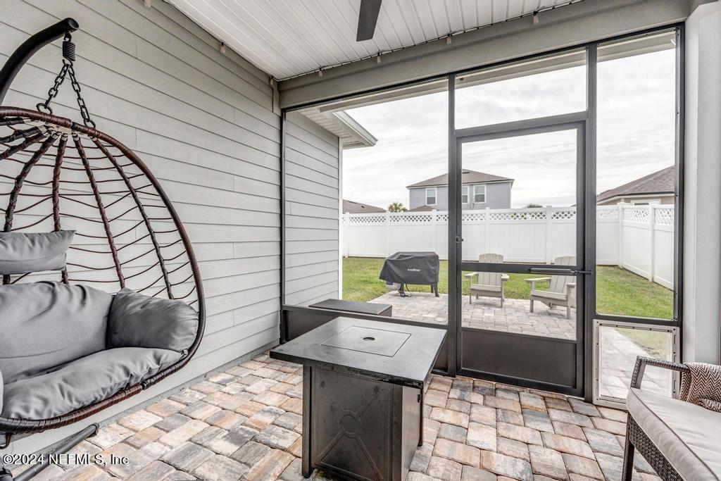 196 Creekmore Drive St. Augustine, FL 32092 - Photo 35 of 51 a living room with large windows