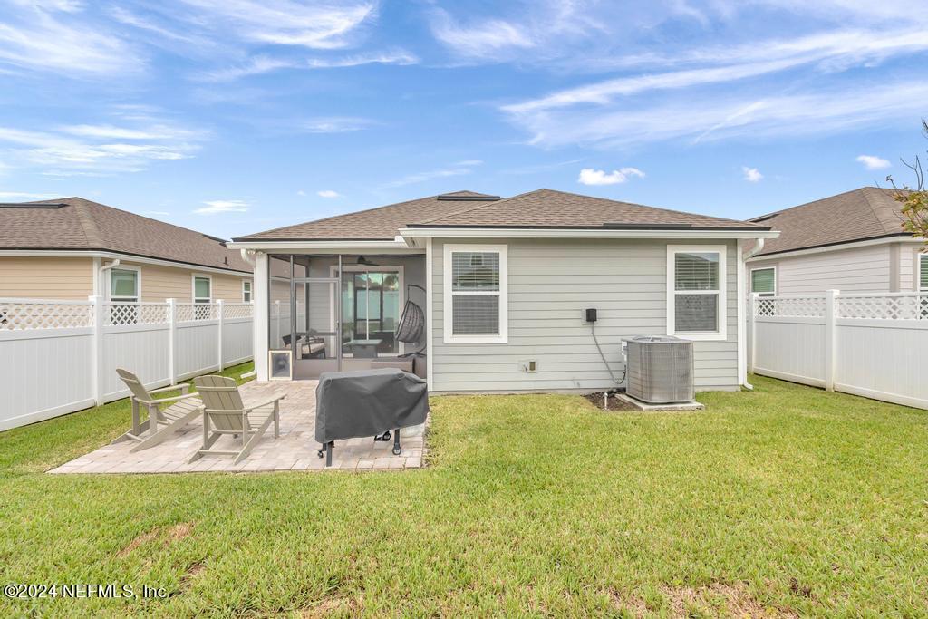 196 Creekmore Drive St. Augustine, FL 32092 - Photo 38 of 51 a view of a house with swimming pool and porch