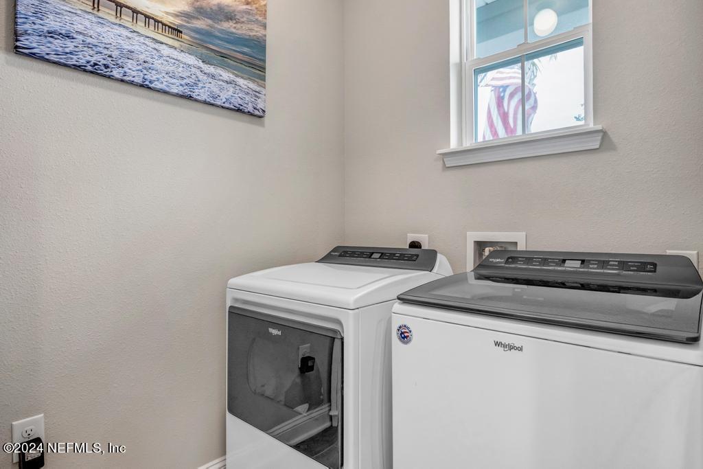 196 Creekmore Drive St. Augustine, FL 32092 - Photo 4 of 51 a utility room with dryer and washer