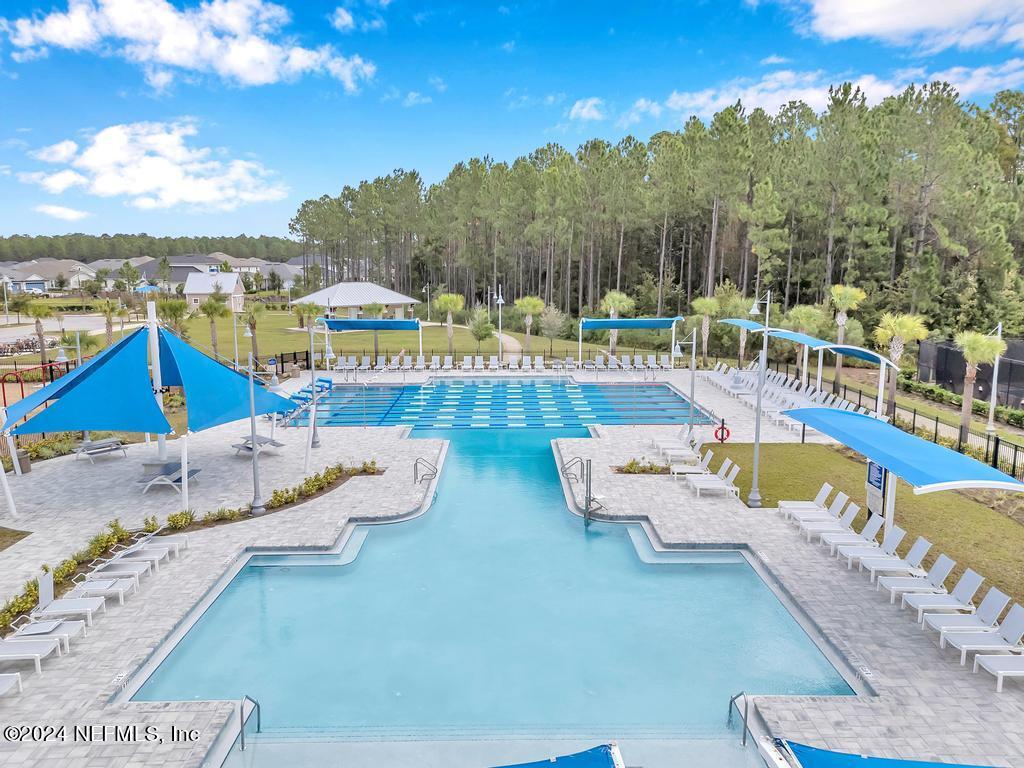 196 Creekmore Drive St. Augustine, FL 32092 - Photo 41 of 51 a view of a swimming pool with lounge chair