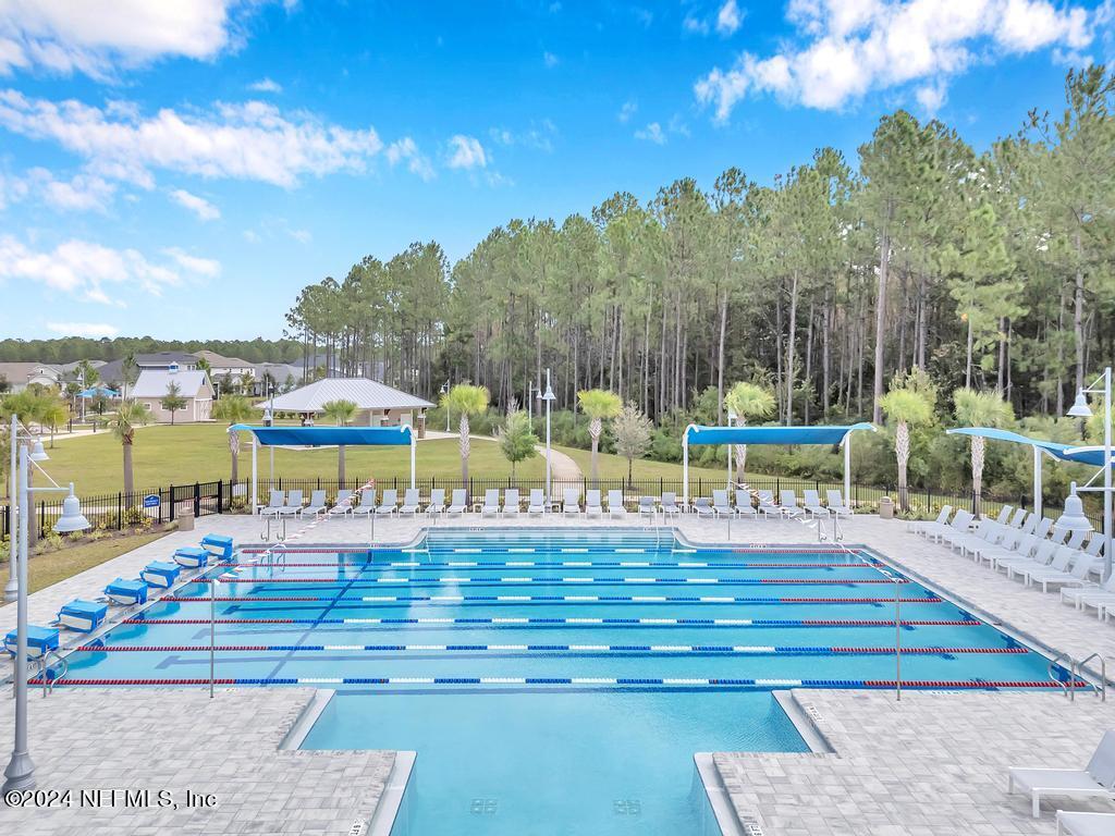 196 Creekmore Drive St. Augustine, FL 32092 - Photo 42 of 51 a view of a swimming pool with seating area and furniture
