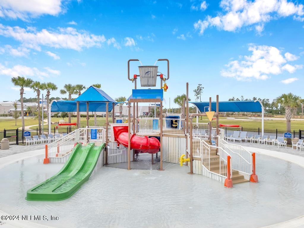 196 Creekmore Drive St. Augustine, FL 32092 - Photo 44 of 51 a view of a swimming pool with a lounge chair and sofas