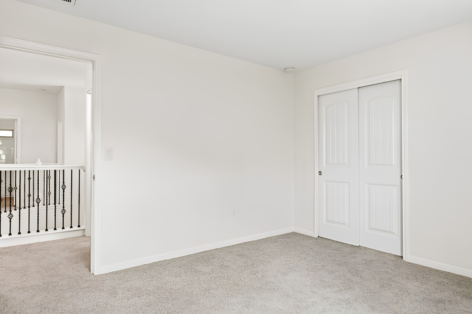 304 Santa Maria Street Georgetown, TX 78628 - Photo 27 of 37 A well-lit landing area connects to the hall and features a double door closet, ideal for storage.