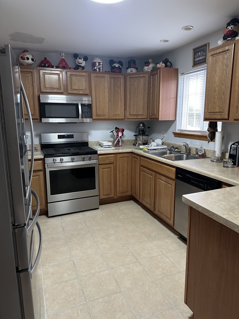 5 Emily Drive Spring Valley, IL 61362 - Photo 6 of 21 a kitchen with stainless steel appliances granite countertop a sink stove and cabinets