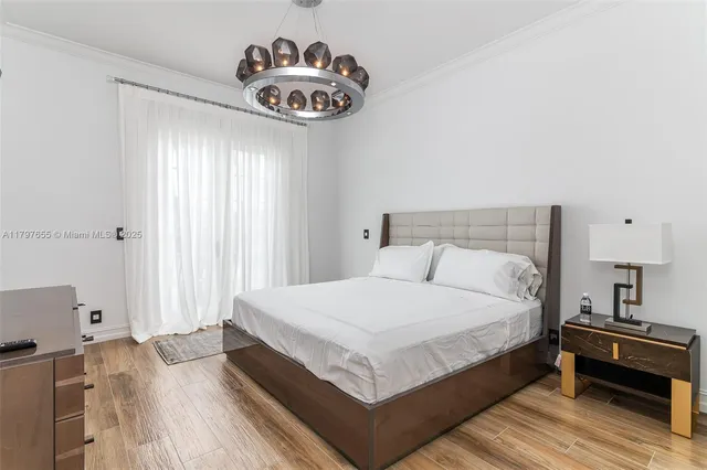 a view of a house with swimming pool and sitting area