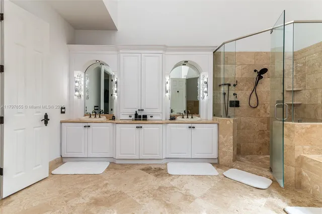 a bedroom with a large bed and a flat screen tv