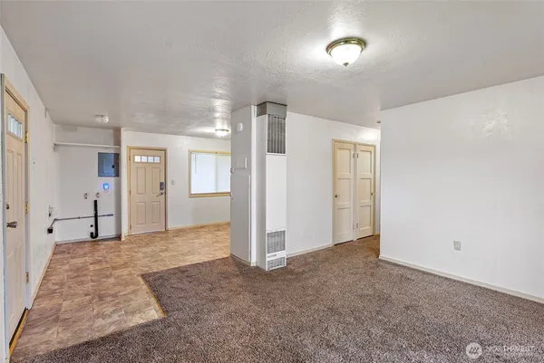 a view of a hallway with closet area