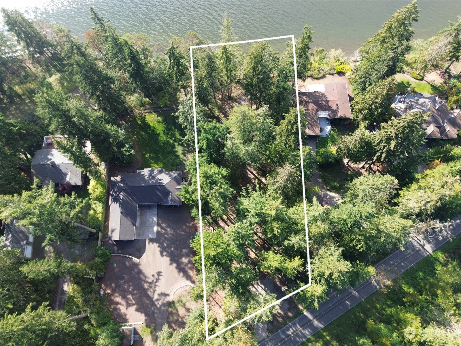 795 East Sequim Bay Road Sequim, WA 98382 - Photo 2 of 36 an aerial view of house with yard and outdoor seating