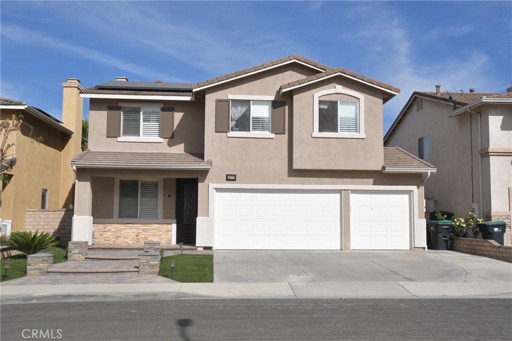 16777 Elk Horn Avenue Chino Hills, CA 91709 - Photo 1 of 20 a front view of a house with a yard and garage