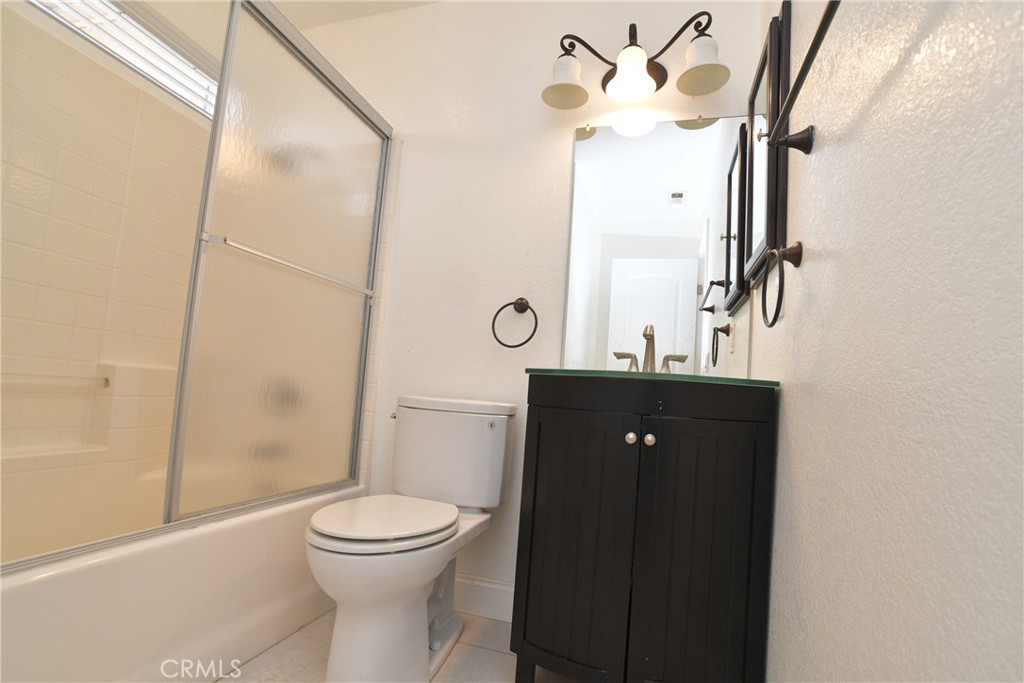 16777 Elk Horn Avenue Chino Hills, CA 91709 - Photo 12 of 20 a bathroom with a toilet a sink and mirror