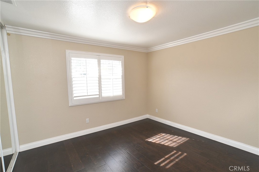 16777 Elk Horn Avenue Chino Hills, CA 91709 - Photo 16 of 20 an empty room with wooden floor and windows
