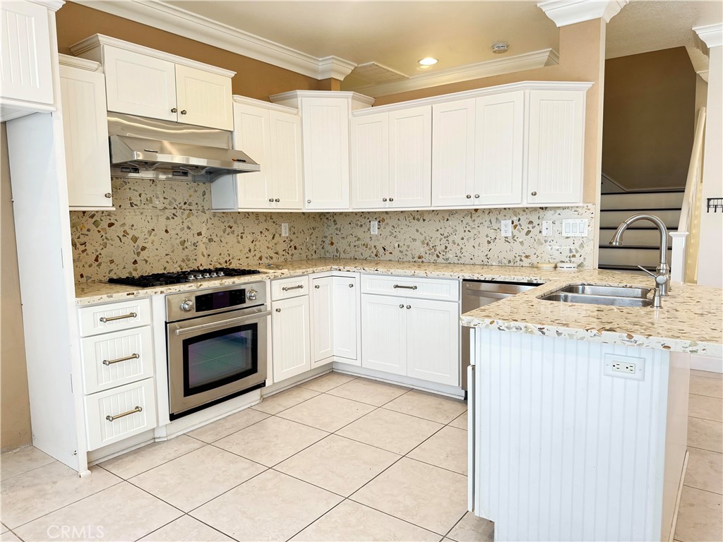 16777 Elk Horn Avenue Chino Hills, CA 91709 - Photo 7 of 20 a kitchen with stainless steel appliances granite countertop a stove a sink and a refrigerator