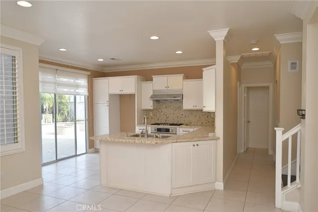 a large bathroom with a large mirror vanity and shower