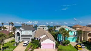a front view of a house with a yard and a garage