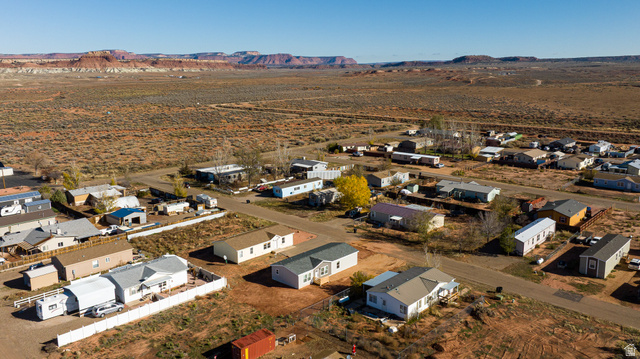749 Riddle Drive Fredonia, AZ 86022 - Photo 39 of 41 Aerial view of property and surrounding area with nearby suburban area and a mountainous background