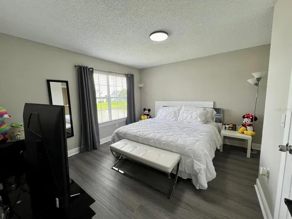 a bathroom with a sink mirror vanity and toilet
