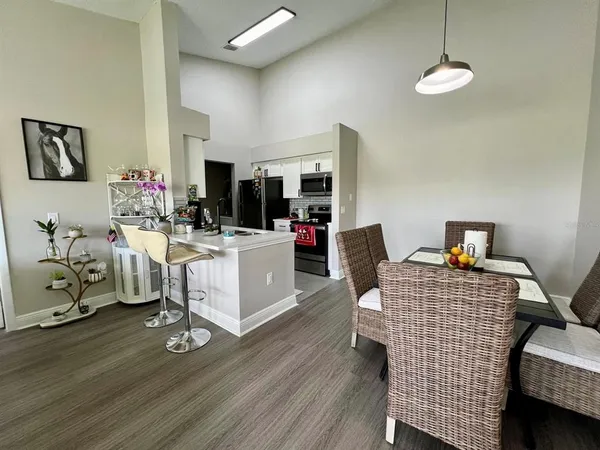 a kitchen with a sink a stove and a microwave