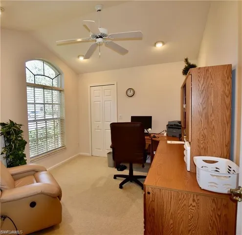 a workspace with furniture and a window