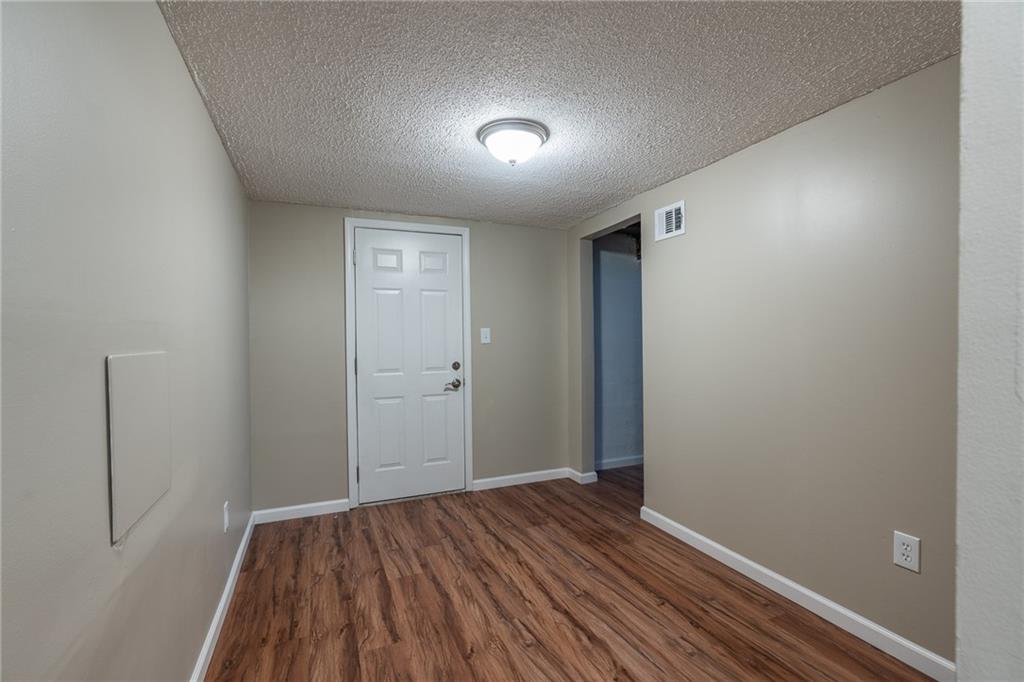 562 Filmore Road Pittsburgh, PA 15221 - Photo 24 of 25 a view of hallway with wooden floor
