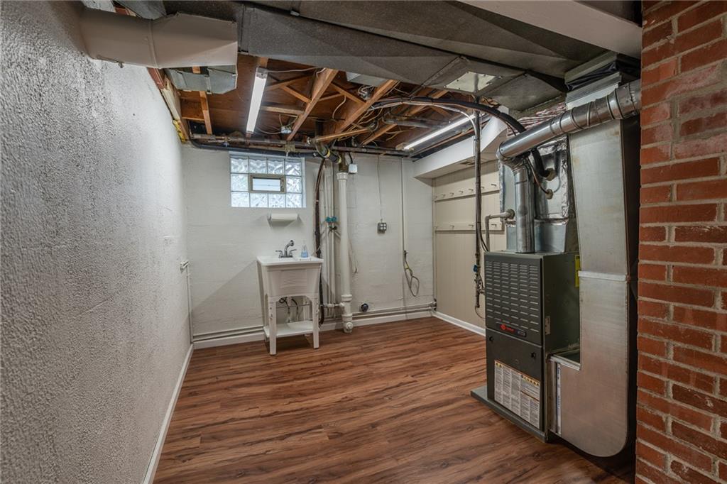 562 Filmore Road Pittsburgh, PA 15221 - Photo 25 of 25 a view of a hallway with wooden floor