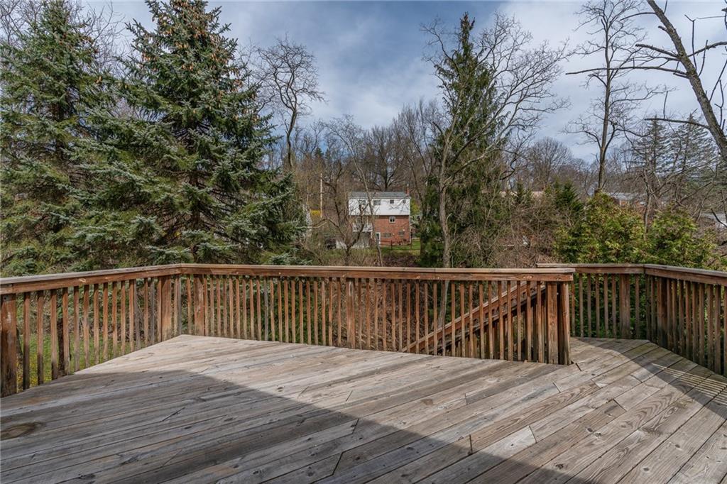 562 Filmore Road Pittsburgh, PA 15221 - Photo 5 of 25 a balcony with wooden floor and fence