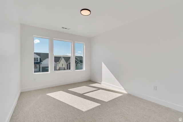 1302 1475 East, Unit 40 Payson, UT 84651 - Photo 29 of 34 Unfurnished room featuring light carpet and baseboards
