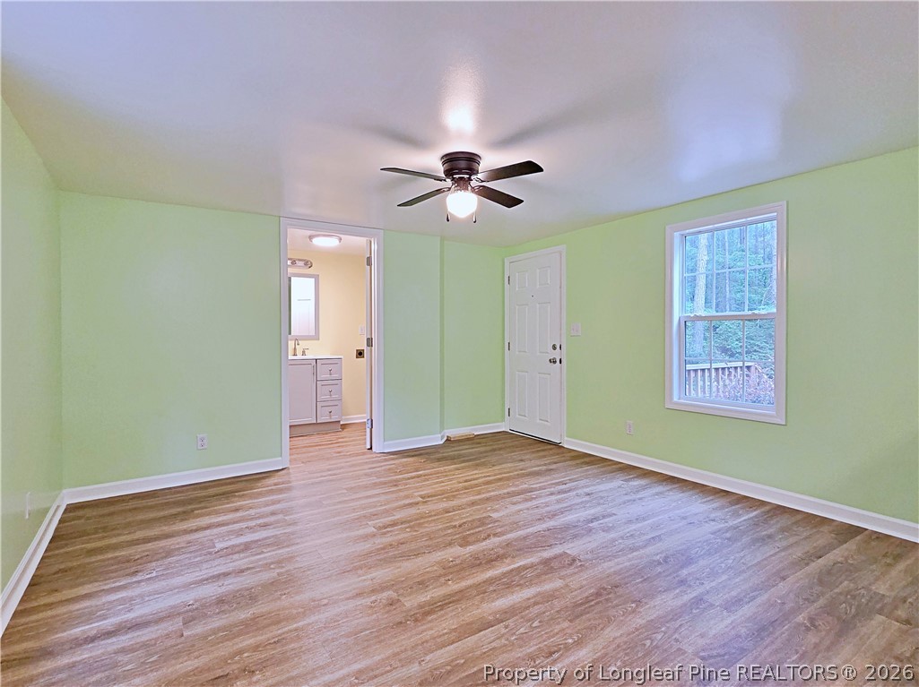 1031 Pine Acres Road White Oak, NC 28399 - Photo 4 of 29 wooden floor in an empty room with a window