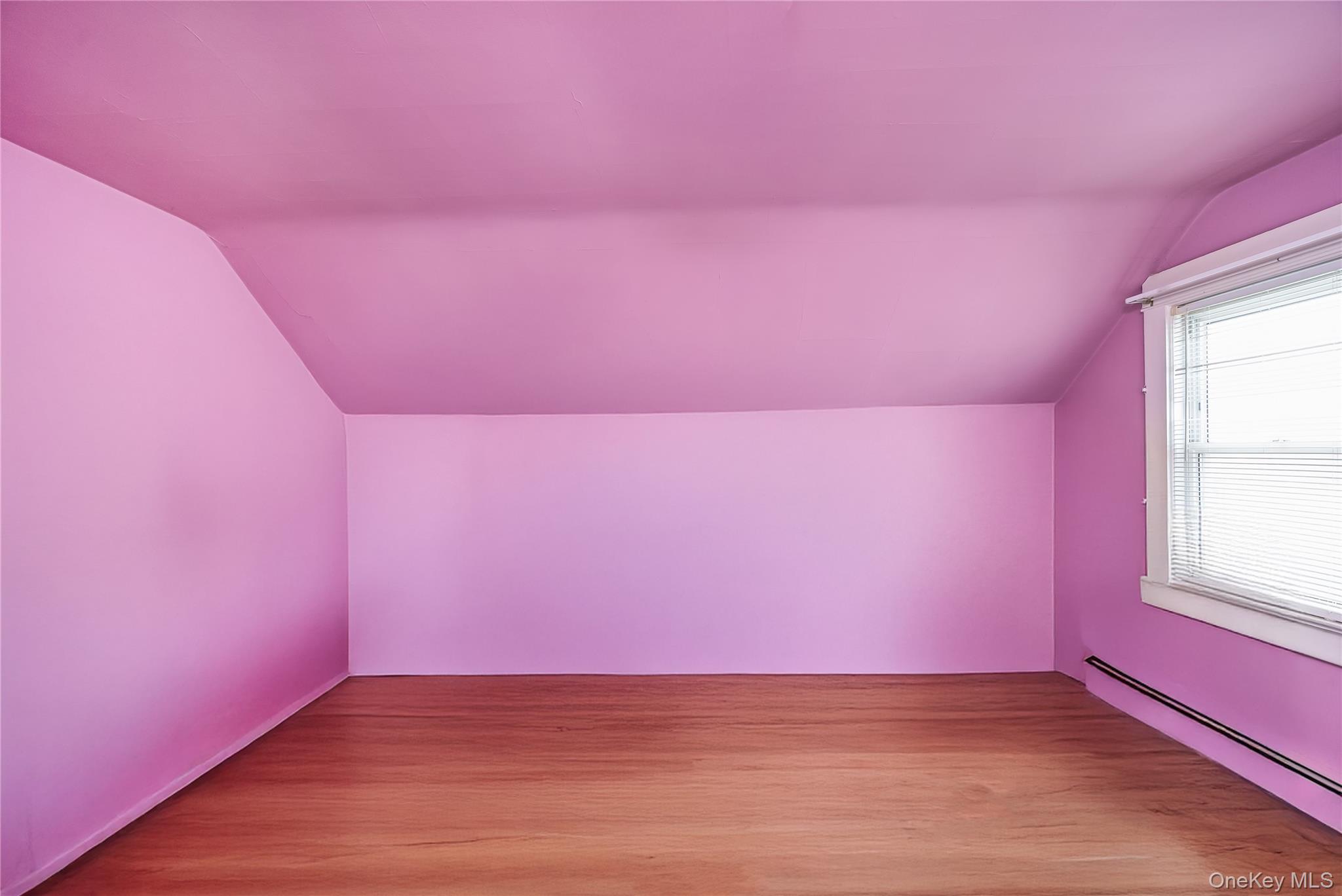 24 Bay 3rd Street Islip, NY 11751 - Photo 15 of 27 a view of empty room with wooden floor and fan