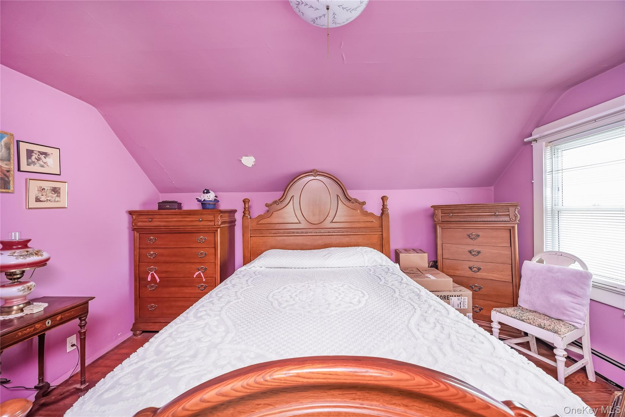 24 Bay 3rd Street Islip, NY 11751 - Photo 16 of 27 a bedroom with a bed and a dresser in it