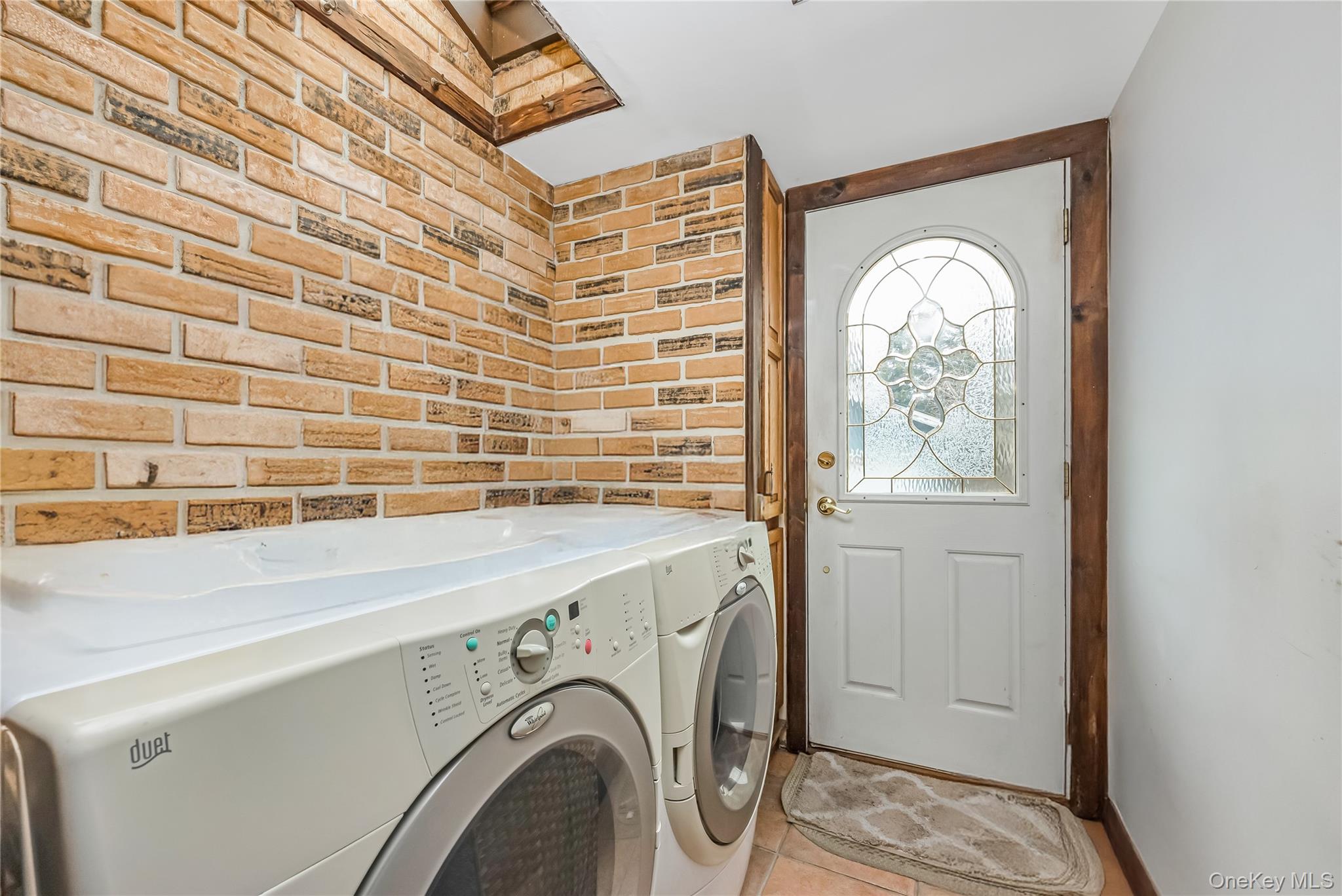 24 Bay 3rd Street Islip, NY 11751 - Photo 17 of 27 a utility room with dryer and washer