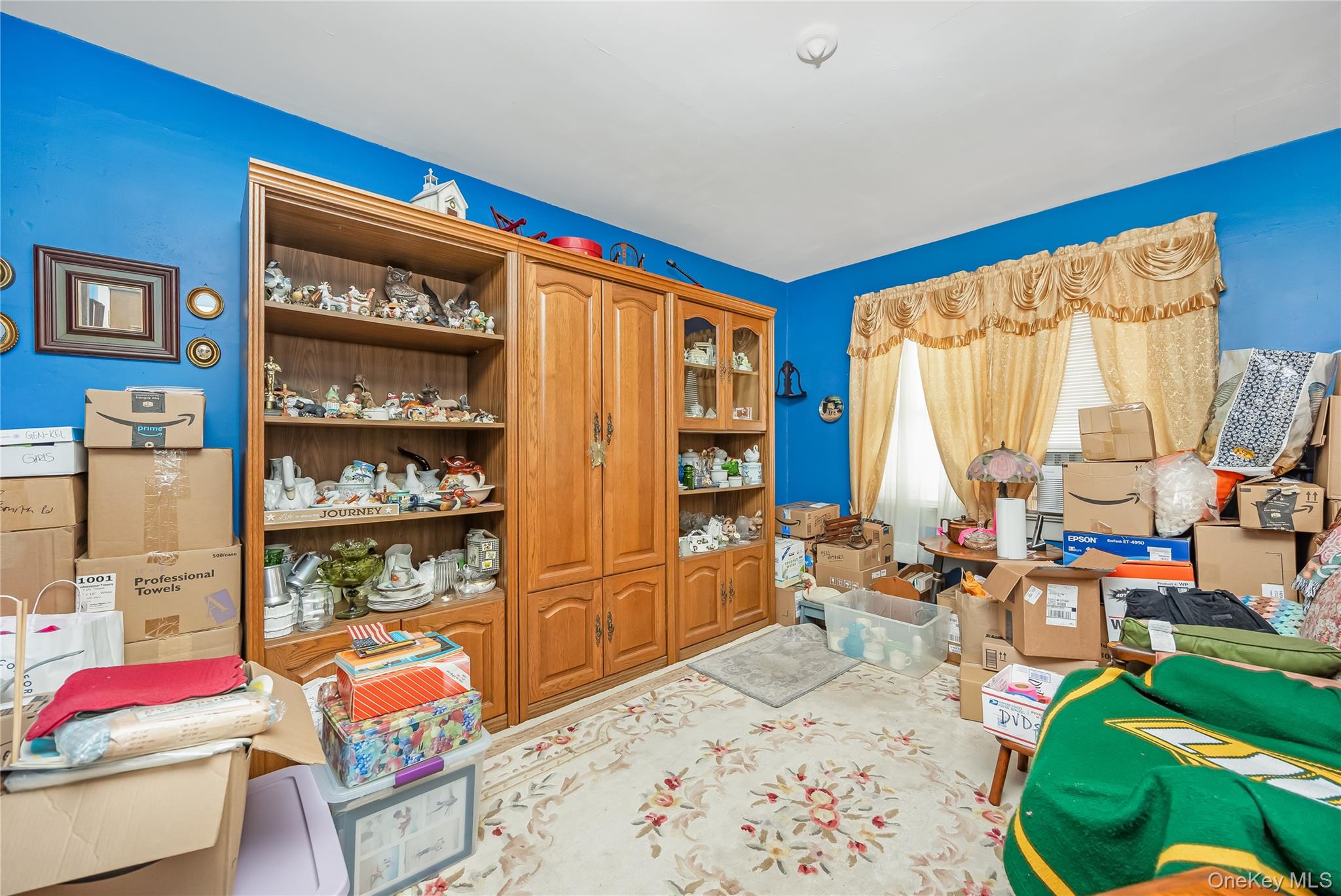 24 Bay 3rd Street Islip, NY 11751 - Photo 18 of 27 a living room with furniture a rug and a window