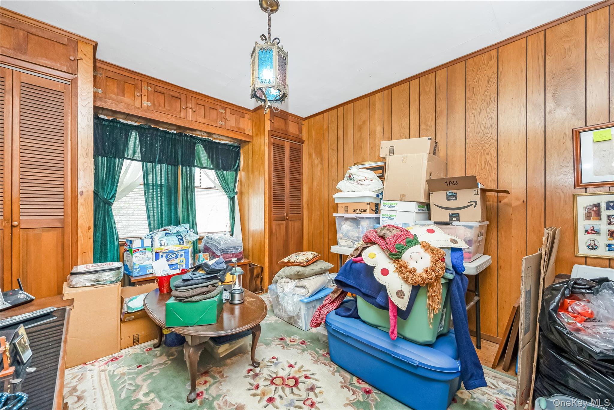 24 Bay 3rd Street Islip, NY 11751 - Photo 23 of 27 a living room filled with furniture and a chandelier