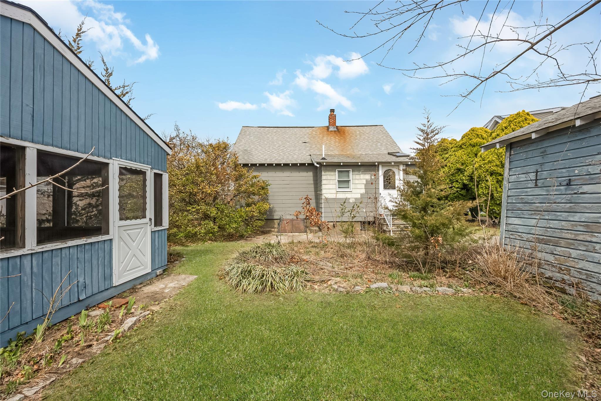24 Bay 3rd Street Islip, NY 11751 - Photo 25 of 27 a view of a house with a small yard and wooden floor and fence