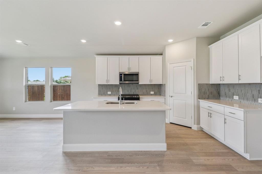 a large kitchen with cabinets