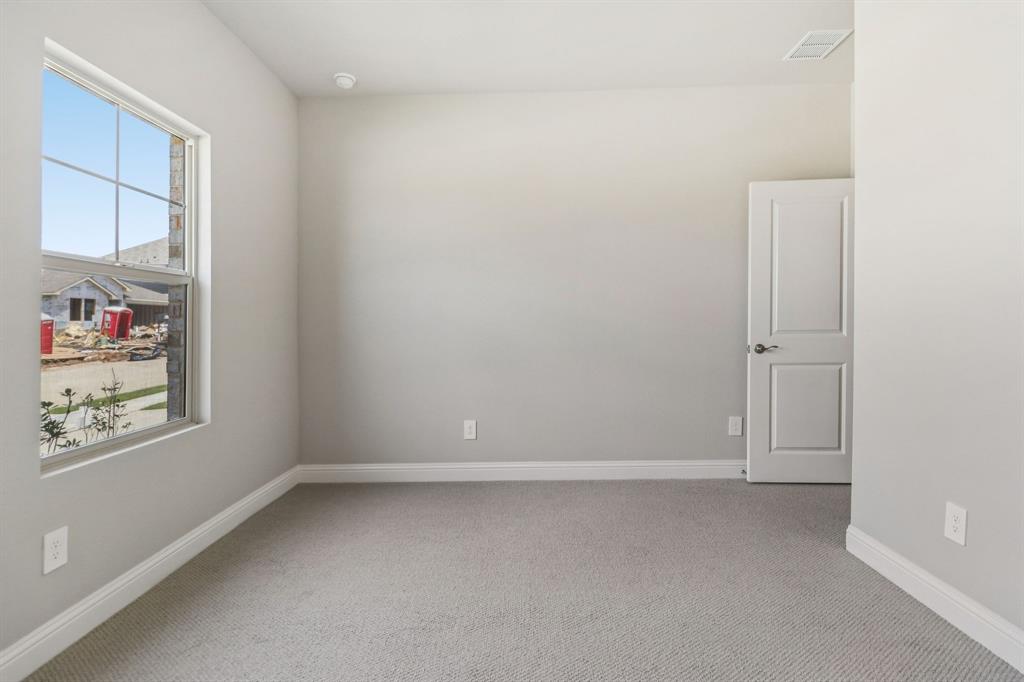 2219 Rannoch Street Sherman, TX 75092 - Photo 29 of 32 an empty room with windows