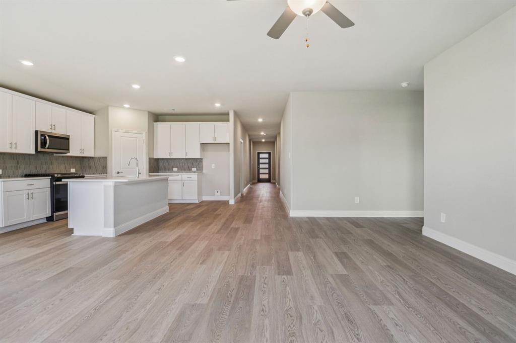 2219 Rannoch Street Sherman, TX 75092 - Photo 6 of 32 a view of kitchen with wooden floor and electronic appliances