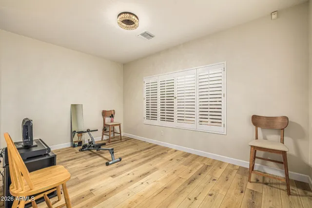 a work room with a window and chairs