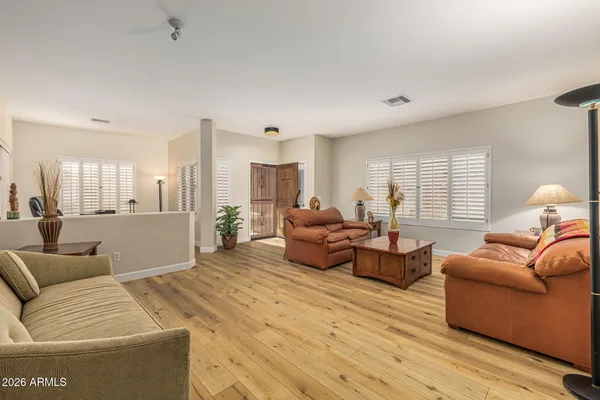 a living room with furniture and a large window