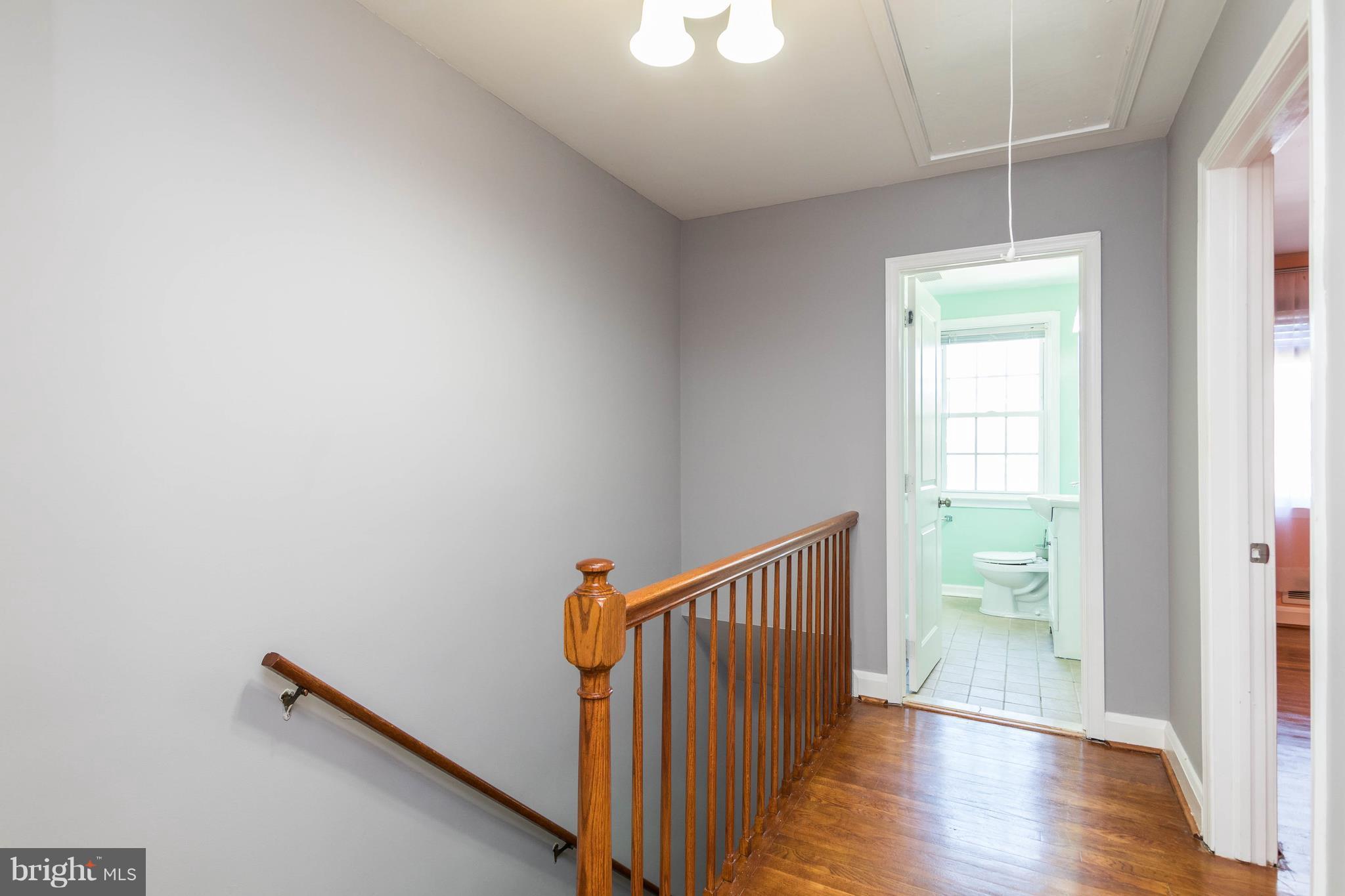1515 Dellsway Road Baltimore, MD 21286 - Photo 12 of 29 2nd level hallway with pull-down steps to attic