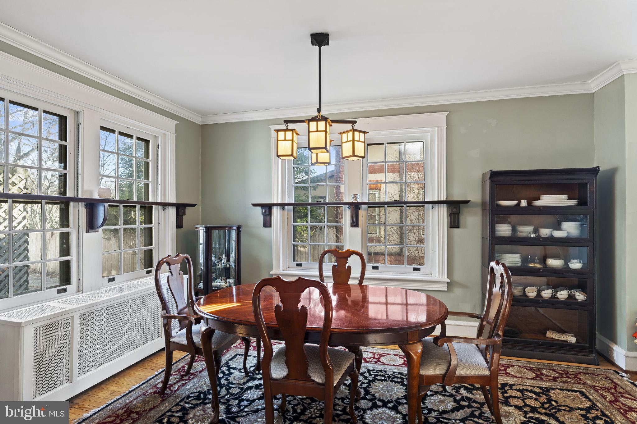 339 Park Avenue Swarthmore, PA 19081 - Photo 12 of 54 a dining room with furniture a chandelier and wooden floor
