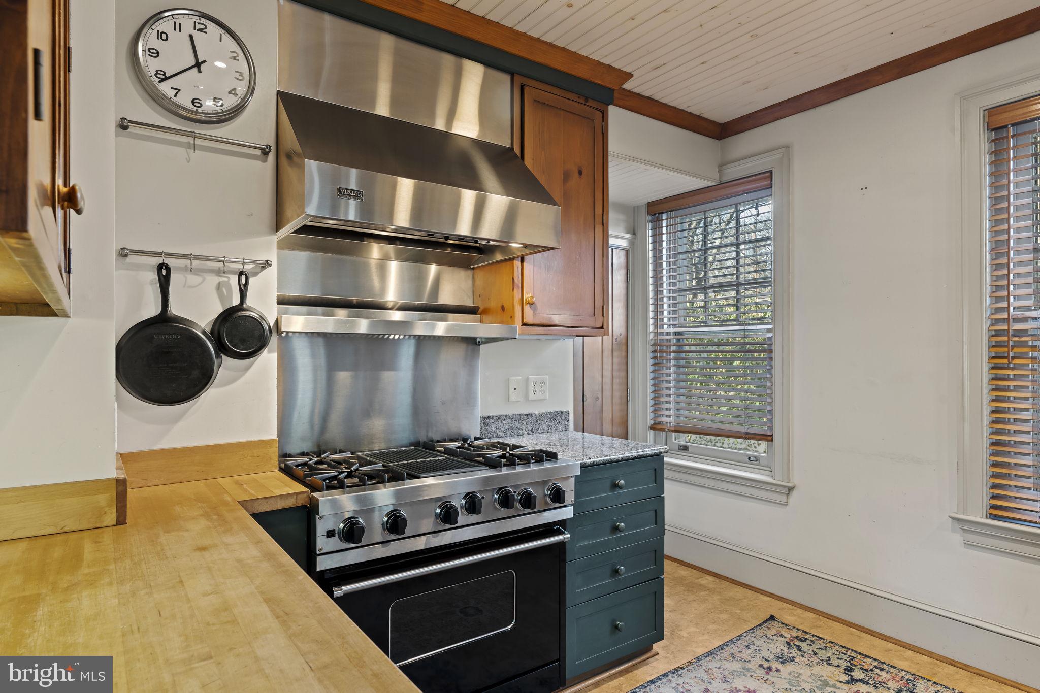 339 Park Avenue Swarthmore, PA 19081 - Photo 14 of 54 a kitchen with a stove and a clock