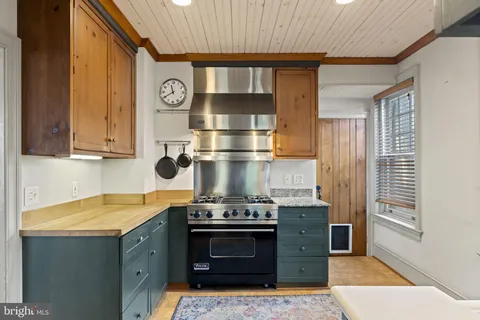 a kitchen with a stove and a cabinet