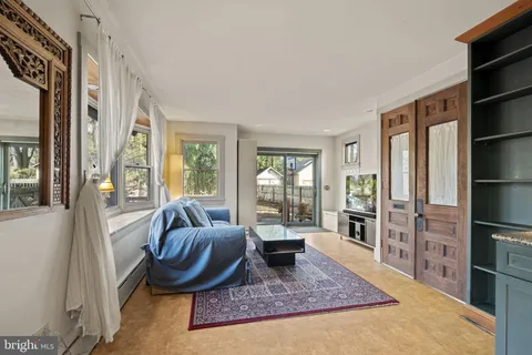a living room with furniture and a rug